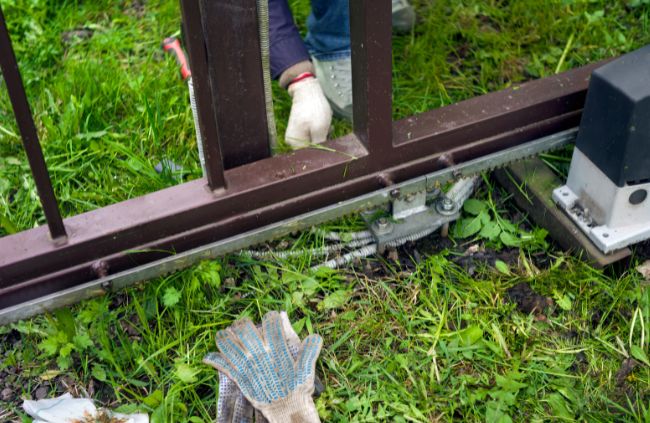 Automatic gate maintenance on a sliding gate motor and track system, part of reliable automatic gate servicing by Auto Gate Guys Gold Coast Automatic gate maintenance on a sliding gate motor and track system, part of reliable automatic gate servicing by Auto Gate Guys Gold Coast