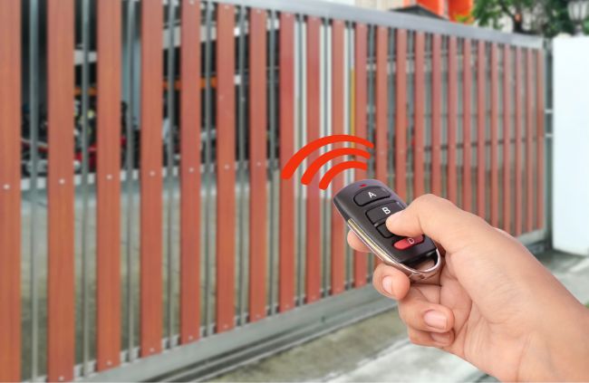 Wireless gate opener controlling a modern sliding gate installed by Auto Gate Guys Gold Coast, offering convenience and security for Gold Coast homes Wireless gate opener controlling a modern sliding gate installed by Auto Gate Guys Gold Coast, offering convenience and security for Gold Coast homes